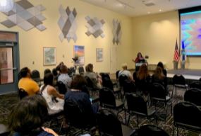 Attendees listen to book author Caridad Moro-Gronlier