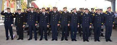 Honorees salute during ceremony