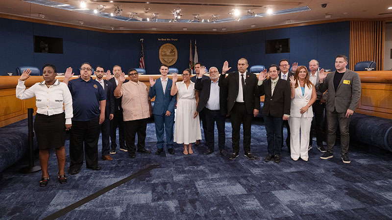 A group of Community Council members being sworn in.